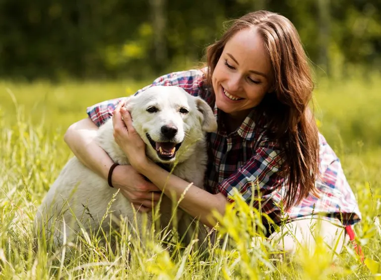 woman enjoying with dog countryside